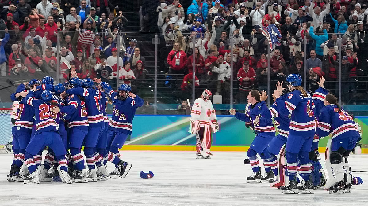 United States players celebrate after a women's ice hockey gold medal game between the United States and Canada at the 2026 Winter Olympics, in Milan, Italy, Thursday, Feb. 19, 2026. - AP Photo/Hassan Ammar
