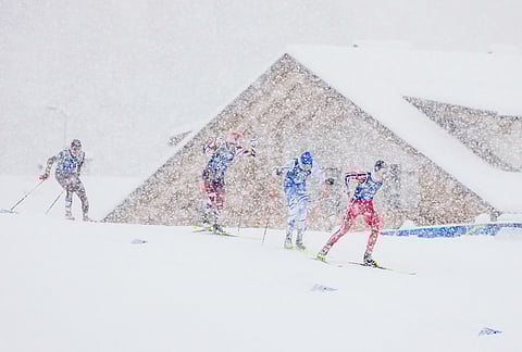 Jens Luraas Oftebro, of Norway, from right, Eero Hirvonen, of Finland and Johannes Lamparter, of Austria, compete in the nordic combined team sprint at the 2026 Winter Olympics, in Tesero, Italy.