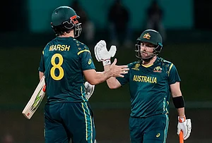 | Photo: AP/Eranga Jayawardena : Australia's captain Mitchell Marsh and Australia's Adam Zampa celebrate after winning the T20 World Cup cricket match between Australia and Oman in Pallekele, Sri Lanka.