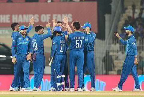 Afghanistan's captain Rashid Khan, third left, celebrates with teammates the wicket of Canada's Shreyas Movva during the T20 World Cup cricket match between Afghanistan and Canada in Chennai.