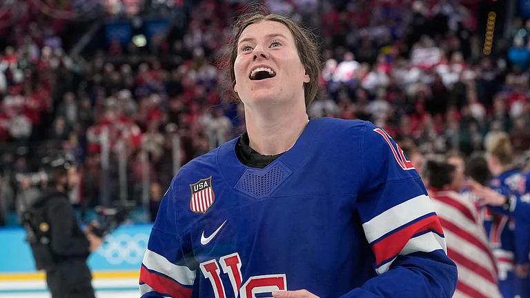 United States' Kelly Pannek (12) celebrates after a women's ice hockey gold medal game between the United States and Canada at the 2026 Winter Olympics, in Milan, Italy, Thursday, Feb. 19, 2026 - (AP Photo/Hassan Ammar)