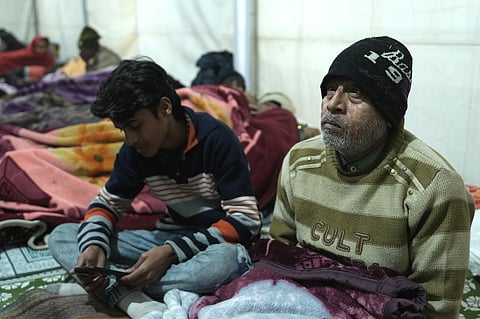 Sarfaraz Hussain with his family, living in a tent outside AIIMS Delhi 