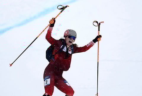 Switzerland's Marianne Fatton celebrates winning a ski mountaineering women's final at the 2026 Winter Olympics, in Bormio, Italy.