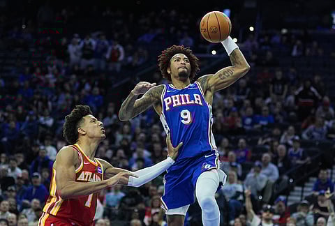 Philadelphia 76ers' Kelly Oubre Jr. (9) goes up to shoot against Atlanta Hawks' Jalen Johnson during the second half of an NBA basketball game in Philadelphia.