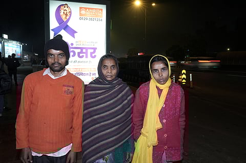 Asha Devi with her son and daughter outside AIIMS Delhi 
