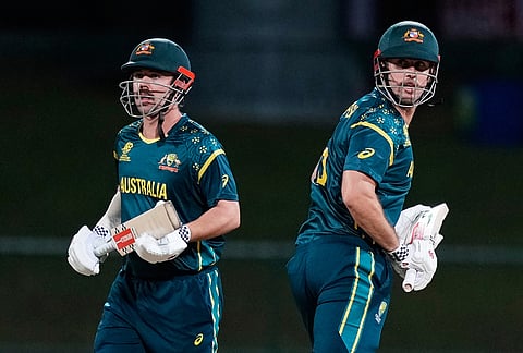 Australia's Travis Head and captain Mitchell Marsh run between the wickets during the T20 World Cup cricket match between Australia and Oman in Pallekele, Sri Lanka.