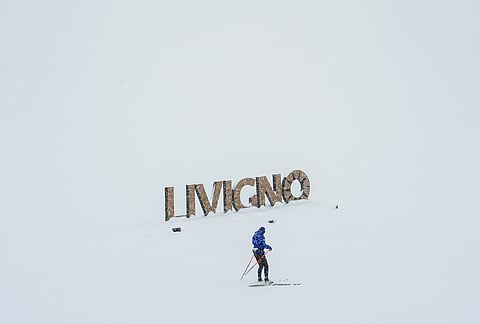 A person cross-country skis, Thursday, Feb. 19, 2026, during the 2026 Winter Olympics in Livigno, Italy.
