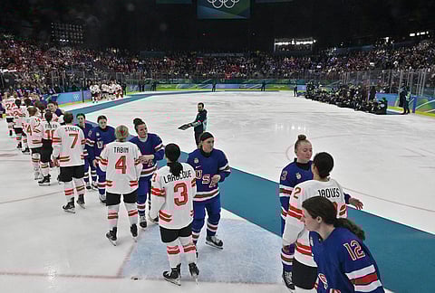 Canada's players and United States players shake hands after the women's ice hockey gold medal game between the United States and Canada at the 2026 Winter Olympics, in Milan, Italy.