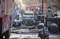 PTI : People gather around charred remains after a fire broke out at a factory in Sector 24, in Faridabad, Monday, Feb. 16, 2026. More than 35 people were rushed to hospitals with burns in the incident.