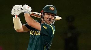 (AP Photo/Eranga Jayawardena) : Australia's Travis Head plays a shot during the T20 World Cup cricket match between Australia and Oman in Pallekele, Sri Lanka, Friday, Feb. 20, 2026.