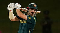 (AP Photo/Eranga Jayawardena) : Australia's Travis Head plays a shot during the T20 World Cup cricket match between Australia and Oman in Pallekele, Sri Lanka, Friday, Feb. 20, 2026. 