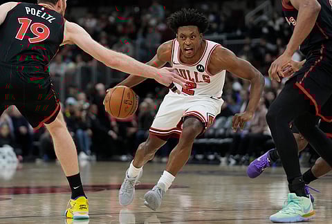 Chicago Bulls guard Collin Sexton (2) handles the ball during the first half of an NBA basketball game against the Toronto Raptors in Chicago.