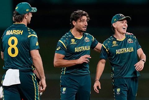 Australia's Marcus Stoinis celebrates with teammates the wicket of Oman's Vinayak Shukla during the T20 World Cup cricket match between Australia and Oman in Pallekele, Sri Lanka.