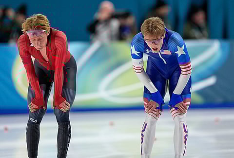 Jordan Stolz of the U.S., right, and Peder Kongshaug of Norway catch their breath after competing in the men's 1500 meters speedskating race at the 2026 Winter Olympics, in Milan, Italy.