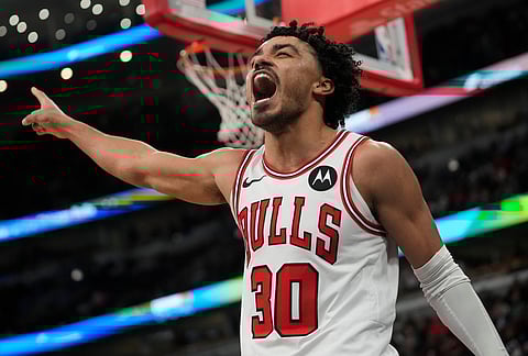 Chicago Bulls guard Tre Jones (30) reacts to a turnover by the Toronto Raptors during the second half of an NBA basketball game in Chicago.
