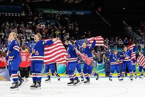 United States players celebrate after the victory ceremony for women's ice hockey at the 2026 Winter Olympics, in Milan, Italy.