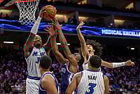 Sacramento vs Orlando, NBA: Paolo Banchero Stars In Magic's Big Win As Kings Suffer 15th Straight Loss | Photo: AP/Randall Benton : Orlando Magic center Wendell Carter Jr., left, guard Anthony Black, and guard Desmond Bane battle for a rebound with Sacramento Kings forward Precious Achiuwa during the second half of an NBA basketball game in Sacramento,
California.