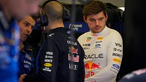 | Photo: AP/Altaf Qadri : Red Bull driver Max Verstappen of the Netherlands looks on as mechanics prepare his car during the third day of Formula One pre-season test at the Bahrain International Circuit in Sakhir, Bahrain, Friday, Feb. 13, 2026.