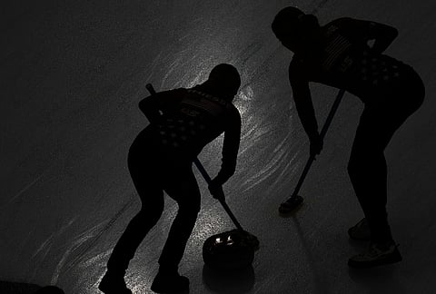 Taylor Anderson-Heide of the United States, right, and Cory Thiesse of the United States compete against Switzerland during the curling women's semifinal match at the 2026 Winter Olympics, in Cortina d'Ampezzo, Italy.