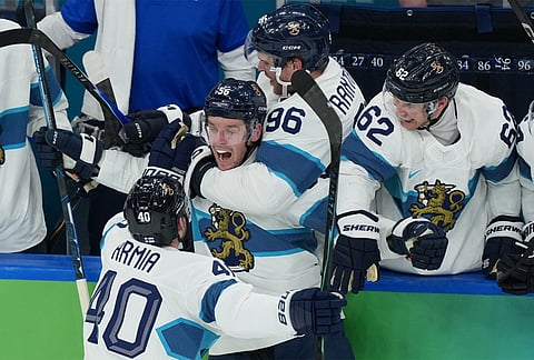 Finland's Erik Haula (56) celebrates after scoring a goal against Canada during the second period of a men's ice hockey semifinal game at the 2026 Winter Olympics in Milan, Italy.