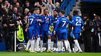 Premier League Highlights, Saturday Goal Rush: 10-Man Chelsea, Aston Villa Drop Points At Home; Brentford Lose 2-0 | Photo: AP/Ben Whitley : Chelsea's Joao Pedro celebrates scoring their side's first goal of the game during their English Premier League soccer match against Burnley in London, Saturday, Feb. 21, 2026.