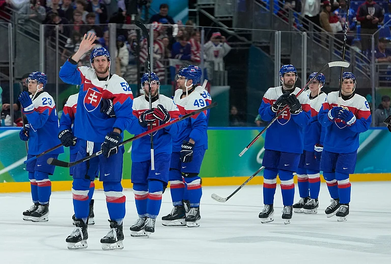 Slovakia players greet fans at the end of a men's ice hockey semifinal game between United States and Slovakia at the 2026 Winter Olympics, in Milan, Italy. - | Photo: AP/Petr David Josek