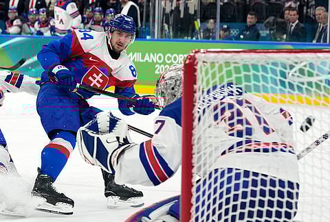 Slovakia's Pavol Regenda (84) scores his side's second goal during a men's ice hockey semifinal game between the United States and Slovakia at the 2026 Winter Olympics, in Milan, Italy.