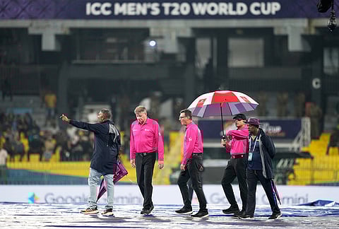 Match umpires inspect the ground before the start of the T20 World Cup cricket match between New Zealand and Pakistan in Colombo, Sri Lanka.