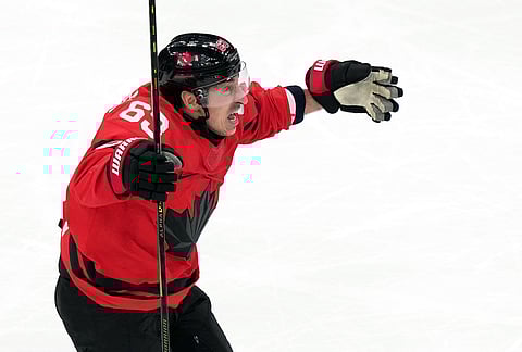 Canada's Brad Marchand celebrates after teammate Shea Theodore scored against Finland during the third period of a men's ice hockey semifinal game at the 2026 Winter Olympics in Milan, Italy.