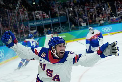 United States' Dylan Larkin (21) celebrates after scoring the opening goal during a men's ice hockey semifinal game between United States and Slovakia at the 2026 Winter Olympics, in Milan, Italy.