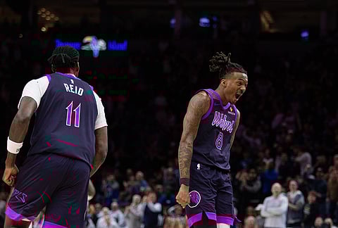 Minnesota Timberwolves' Bones Hyland (8) celebrates a basket against the Dallas Mavericks during the first half of an NBA basketball game in Minneapolis.