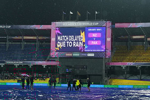A large screen announces a delay in the start of T20 World Cup cricket match between New Zealand and Pakistan due to rain, in Colombo, Sri Lanka.