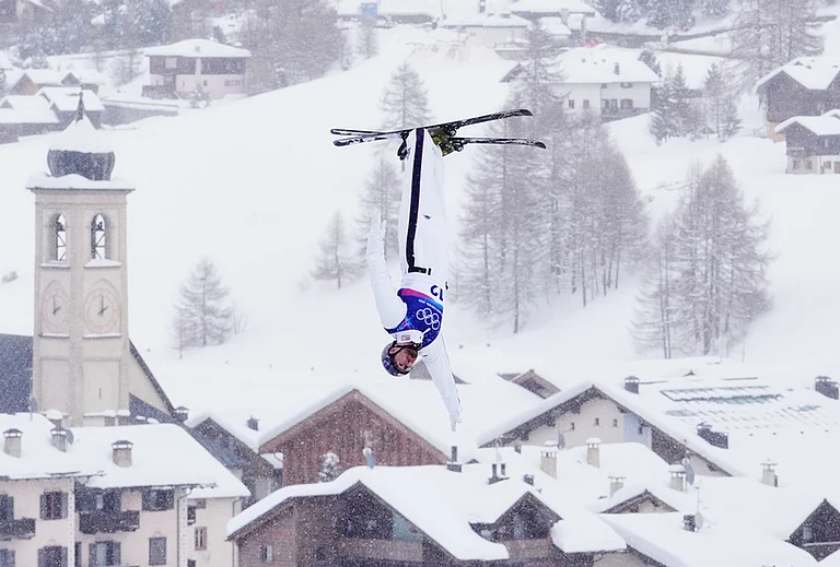 United States' Christopher Lillis competes during the men's freestyle skiing aerials finals at the 2026 Winter Olympics, in Livigno, Italy. - | Photo: AP/Lindsey Wasson