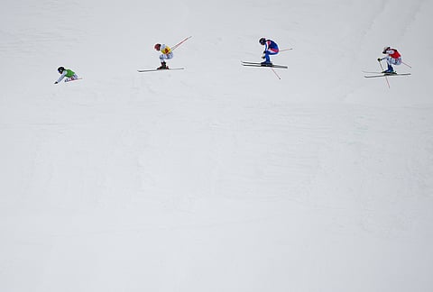 From left, Switzerland's Talina Gantenbein (5), Switzerland's Sixtine Cousin (13), France's Anouck Errard (12) and Switzerland's Saskja Lack (4) compete during the women's ski cross finals at the 2026 Winter Olympics, in Livigno, Italy.
