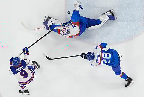 United States' Jack Eichel (9) scores his side's fourth goal during a men's ice hockey semifinal game between the United States and Slovakia at the 2026 Winter Olympics, in Milan, Italy.
