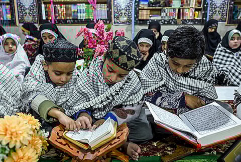 Students attend recitation classes of the holy Quran during the fasting month of Ramzan at a madrasa, in Srinagar.
