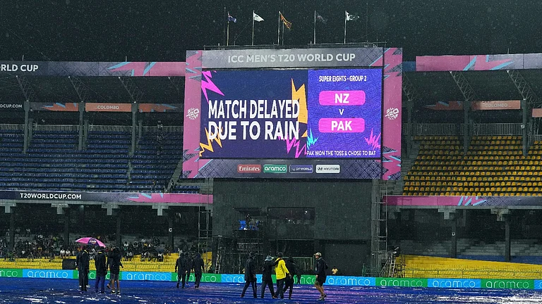 A large screen announces a delay in the start of T20 World Cup cricket match between New Zealand and Pakistan due to rain, in Colombo, Sri Lanka, Saturday, Feb. 21, 2026. - AP Photo/Eranga Jayawardena