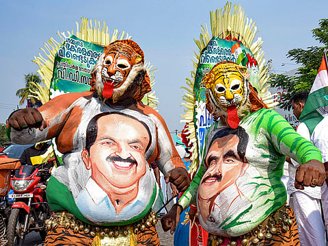 Pulikali artists display paintings of leaders during a reception meeting at Aluva as part of the UDF Puthuyuga Yatra led by Opposition Leader VD Satheesan, in Kochi.