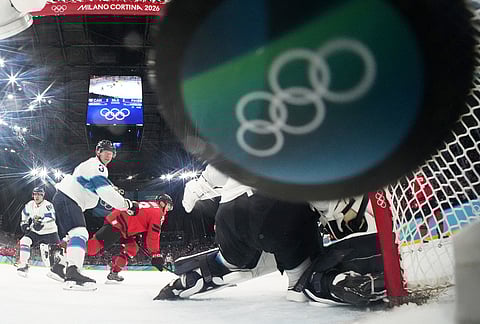 Canada's Nathan MacKinnon, not seen, scores his side's third goal during a men's ice hockey semifinal game between Canada and Finland at the 2026 Winter Olympics, in Milan, Italy.