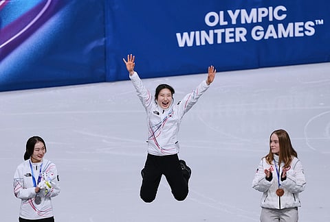 Gilli Kim of the Republic of South Korea receives her gold medal for short track speed skating women's 1500 meters at the 2026 Winter Olympics, in Milan, Italy.