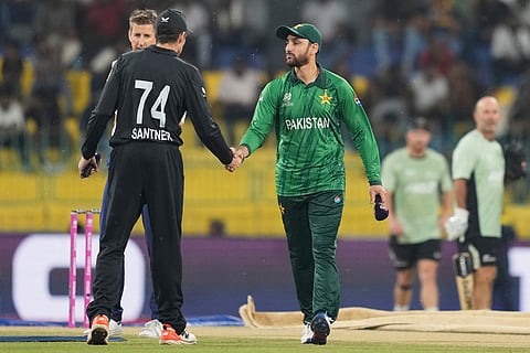 Pakistan's captain Salman Ali Agha, right, shakes hands with New Zealand's captain Mitchel Santner after the coin toss of the T20 World Cup cricket match between New Zealand and Pakistan in Colombo, Sri Lanka.