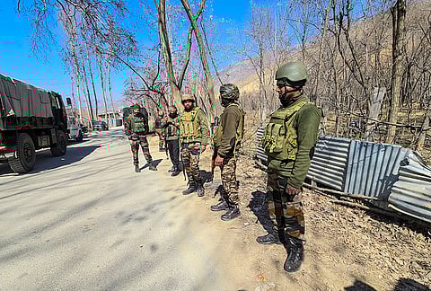 Security forces cordon off the area after detecting a suspicious object, on the Safapora-Ganderbal road, in Ganderbal, Jammu and Kashmir.