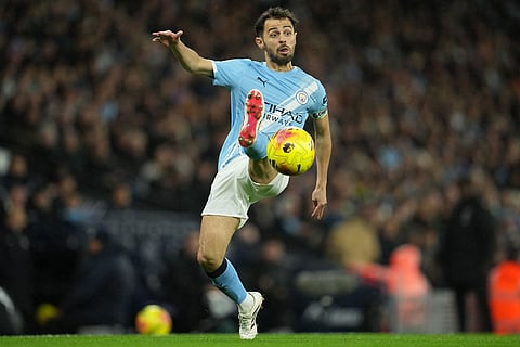 Manchester City's Bernardo Silva receives the ball during the English Premier League soccer match between Manchetser City and Newcastle in Manchester, England.