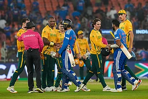 | Photo: PTI/Arun Sharma : South Africa's players being congratulated by India's Varun Chakravarthy and Jasprit Bumrah after winning the ICC Men's T20 World Cup 2026 cricket match between India and South Africa, at the Narendra Modi Stadium, in Ahmedabad.