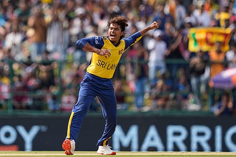 Sri Lanka's Dunith Wellalage celebrates the wicket of England's Jos Buttler during the T20 World Cup cricket match between Sri Lanka and England in Pallekele, Sri Lanka.