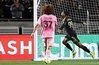 | Photo: AP/Jessie Alcheh : Los Angeles FC forward Denis Bouanga (99) celebrates after scoring a goal as Inter Miami defender Maximiliano Falcón (37) watches during the second half of an MLS soccer match in Los Angeles, Calif.