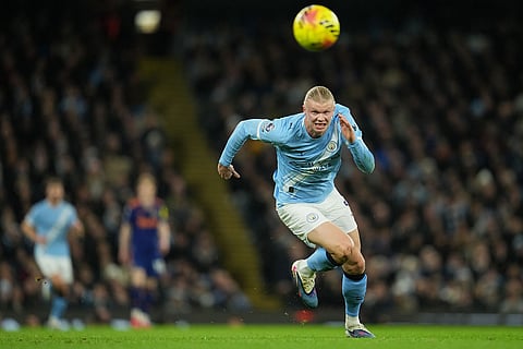Manchester City's Erling Haaland runs for the ball during the English Premier League soccer match between Manchetser City and Newcastle in Manchester, England.