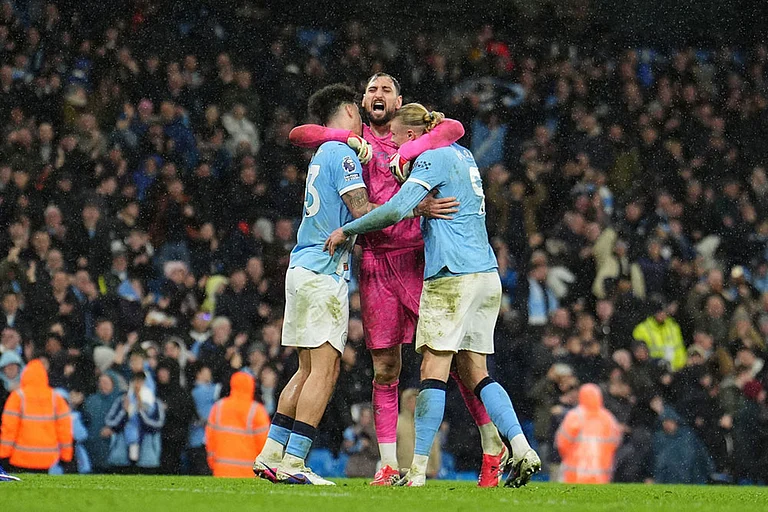 Manchester City's goalkeeper Gianluigi Donnarumma, center, celebrates with Nico O'Reilly, left, and Erling Haaland after the English Premier League soccer match between Manchetser City and Newcastle in Manchester, England. - | Photo: Martin Rickett/PA via AP