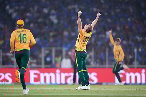 South Africa's Corbin Bosch, center, celebrates the wicket of India's captain Suryakumar Yadav during the T20 World Cup cricket match between India and South Africa in Ahmedabad, India.