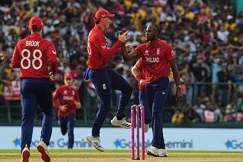 England's Jofra Archer, right, celebrates with teammates the wicket of Sri Lanka's Pathum Nissanka during the T20 World Cup cricket match between Sri Lanka and England in Pallekele, Sri Lanka.